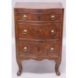 AN 18TH CENTURY CONTINENTAL WALNUT SERPENTINE CHEST, with three graduated long drawers, all with