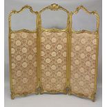 A 19TH CENTURY FRENCH GILT WOOD DRESSING SCREEN, the three panels all part glazed and floral