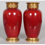 A GOOD PAIR OF RISLER AND VACHETTE GILT MOUNTED PORCELAIN VASES. 7ins high.