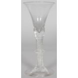 A GOOD GEORGIAN WINE GLASS with inverted bell shaped bowl, annulated rim, single knop on domed feet.