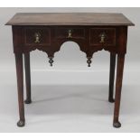 AN 18TH CENTURY STYLE ELM LOWBOY, with three small drawers on turned legs with pad feet. 2ft 6ins