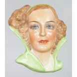 AN ART DECO PORCELAIN BUST OF A LADY. 2ins.