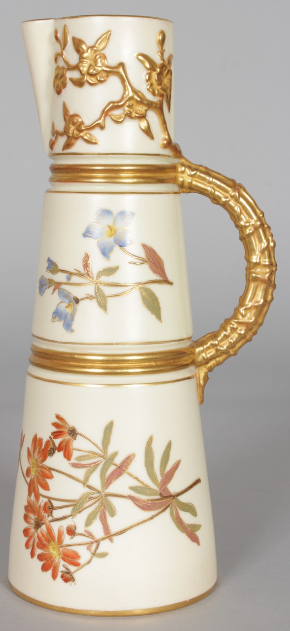 A ROYAL WORCESTER CLARET JUG painted and gilded with flowers, date code for 1892.