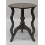 AN 18TH CENTURY AND LATER OAK TRIPOD TABLE, the circular top with carved and punched decoration. 1ft