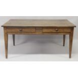 A 19TH CENTURY FRENCH OAK TABLE, with a rectangular planked top, two frieze drawers on tapering