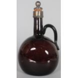 AN AMETHYST GLASS SPIRIT FLAGON with metal stopper. 8.5ins high.