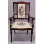 AN EDWARDIAN MAHOGANY ARMCHAIR, with inlaid cresting rail, needlework upholstered back and seat,