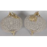 A PAIR OF CUT GLASS AND ORMOLU CEILING LIGHTS, 20TH CENTURY, of spherical form. 1ft 1ins diameter.