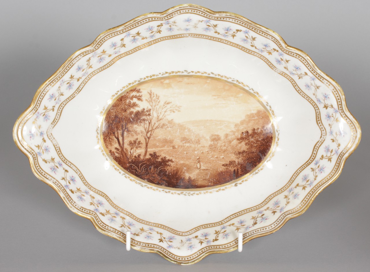 AN 18TH CENTURY DERBY NAVETTE DISH painted in monochrome with a view of Critch, Derbyshire, by