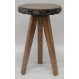 AN OAK CRICKET STYLE TABLE, 20TH CENTURY MADE UP OF EARLIER ELEMENTS, with a circular top, studded