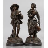 E. CLAVIER A GOOD PAIR OF BRONZE FIGURES, a man with bagpipes, a woman carrying a watering can.