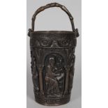 A CLASSICAL BRONZE BUCKET with Latin inscription and five images of Arabs. 7.5ins high.