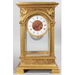 A GOOD FRENCH EMPIRE GILT BRONZE FOUR GLASS CLOCK, with eight-day movement, column supports and