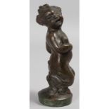 A BRONZE FAUN, on a circular base. 7ins high.