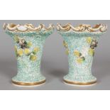 A PAIR OF TRUMPET SHAPED VASES encrusted with flowers and birds. Pattern No. 1428, Col No. 346. 5.