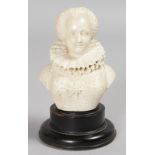 A EUROPEAN CARVED IVORY BUST OF A QUEEN. 3.5ins, on a circular plinth.