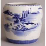 AN 18TH/19TH CENTURY JAPANESE BLUE & WHITE PORCELAIN JARDINIERE, the sides painted with a river