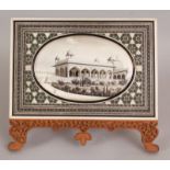 A GOOD 19TH/20TH CENTURY FRAMED INDIAN PAINTING ON IVORY OF A PALACE, rendered in black and gilding,