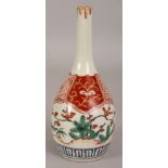 AN 18TH CENTURY JAPANESE IMARI PORCELAIN BOTTLE VASE, the sides painted with ferns, pine and