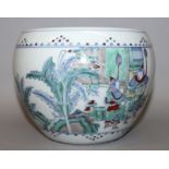 A CHINESE DOUCAI PORCELAIN JARDINIERE, decorated with warriors and officials in a continuous