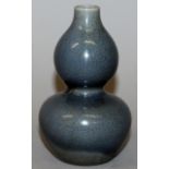 A CHINESE MONOCHROME DOUBLE GOURD CRACKLEGLAZE PORCELAIN VASE, the sides applied with a subdued