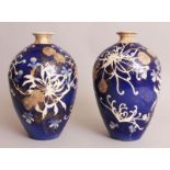 A PAIR OF EARLY 20TH CENTURY BLUE GROUND SATSUMA STYLE EARTHENWARE VASES, each decorated with