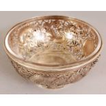 A GOOD QUALITY CHINESE EXPORT PIERCED SILVER DRAGON BOWL, circa 1900, with glass liner, decorated