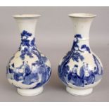 A MIRROR PAIR OF 19TH CENTURY CHINESE BLUE & WHITE PORCELAIN VASES, each painted with a scene of two