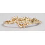 A LOVELY YELLOW GOLD AND DIAMOND SET FLORAL BRACELET.