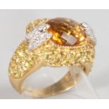 A GOOD TOPAZ AND DIAMOND RING set in 18ct yellow gold.