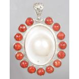 A MOTHER-OF-PEARL AND CORAL PENDANT.