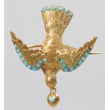 A GOLD AND TURQUOISE BIRD BROOCH.