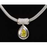 A SUPERB YELLOW DIAMOND TEARDROP PENDANT on an 18ct white gold necklace with diamonds.