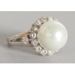 A SILVER, PEARL AND BRILLIANT RING.