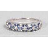 AN 18CT WHITE GOLD, DIAMOND AND SAPPHIRE HOOP RING.