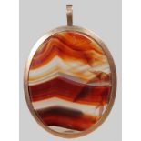 A LARGE AGATE OVAL PENDANT.