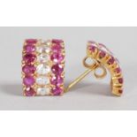 A PAIR OF YELLOW GOLD, RUBY AND DIAMOND HOOP EARRINGS.