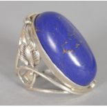 A LARGE LAPIS SILVER ART NOUVEAU DRESS RING.