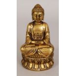 AN ORIENTAL GILT BRONZE FIGURE OF BUDDHA, seated in meditation on a double lotus plinth, the base