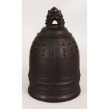 A 19TH CENTURY CHINESE BRONZE MODEL OF A TEMPLE BELL, the shoulders cast in relief with studs, 5.