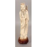 AN EARLY 20TH CENTURY CHINESE CARVED IVORY FIGURE OF LU DONG-PIN, together with a fixed wood