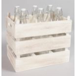 A WOODEN CARRYING CASE and six empty bottles.