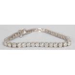 A SUPERB 18CT WHITE GOLD DIAMOND SET BRACELET of 8.2CTS.