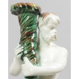 A WEDGWOOD TWO-COLOUR MAJOLICA CANDLESTICK GROUP of A SATYR holding a cornucopia, on a circular