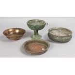 THREE ISLAMIC BRONZE CIRCULAR DISHES and A COMPORT (AF).