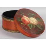 A PAPIER MACHE CIRCULAR BOX with floral lid.