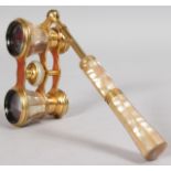 A SET OF EDWARDIAN GILT AND MOTHER-OF-PEARL OPERA GLASSES.