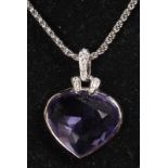 A SWAROVSKI MAUVE STONE PENDANT AND CHAIN.