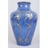 A HEAVY ART POTTERY BLUE VASE, stamped ARP. 13ins high.