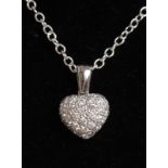 AN 18CT WHITE GOLD DIAMOND HEART SHAPED PENDANT AND CHAIN.